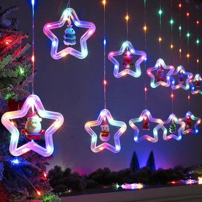 Bunte Stern-Rahmen mit Weihnachtsmann und Schneemann über der Kommode