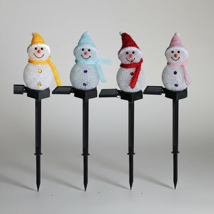 Solar-Schneemann in Gelb, Blau, Rot und Pink auf Erdspiess mit Solarmodul